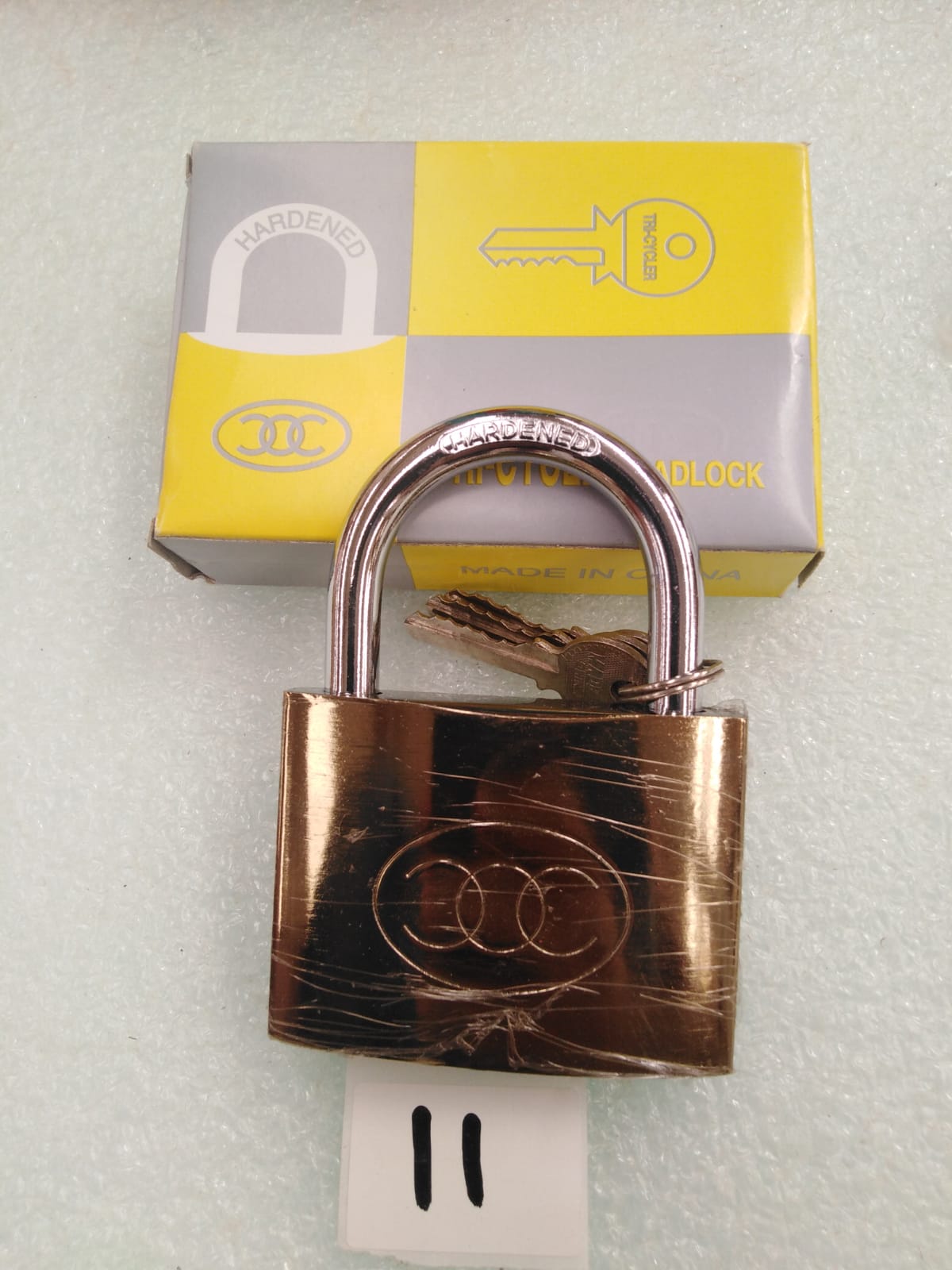 صورة PAD LOCK  BRASS TRI - CYCLER-75 MM (11) GAMALI/قفل نحاسي كبير